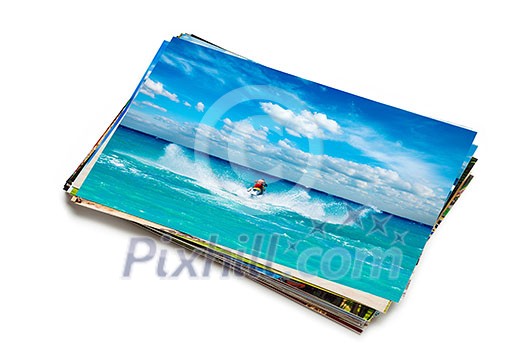 Holidays beach adventure concept creative background - stack of vacation photos with man riding jet ski image on top isolated on white background