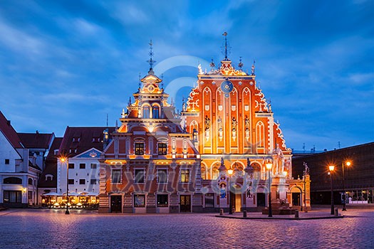 Riga Town Hall Square, House of the Blackheads illuminated in the evening twilight, Riga, Latvia