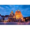 Riga Town Hall Square, House of the Blackheads illuminated in the evening twilight, Riga, Latvia