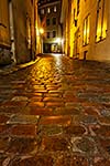 Tallinn Old Town street with cobblestones in night, Estonia