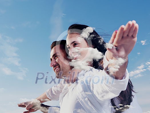 double exposure of romantic young couple and sky clouds