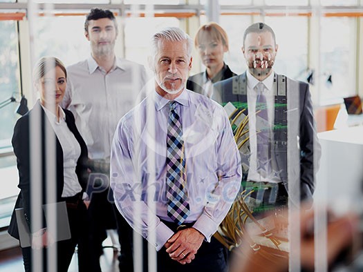 Double exposure design. Senior businessman with his team at office. business people group