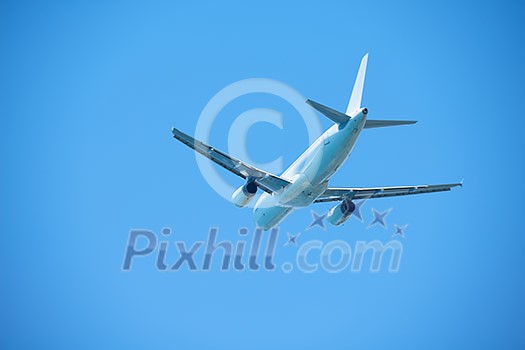 modern airplane travel,  clear blue sky in background