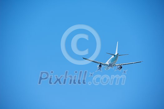 modern airplane travel, clear blue sky in background modern airplane travel, clear blue sky in background