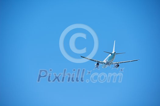 modern airplane travel,  clear blue sky in background