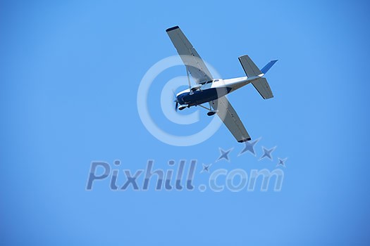 small retro airplane, clear blue sky in background