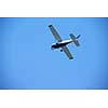 small retro airplane, clear blue sky in background