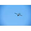 small retro airplane, clear blue sky in background