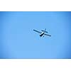 small retro airplane, clear blue sky in background