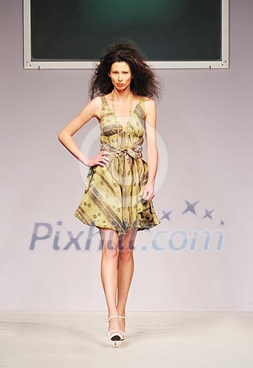 young beautiful model walking on fashion show piste young beautiful model walking on fashion show piste