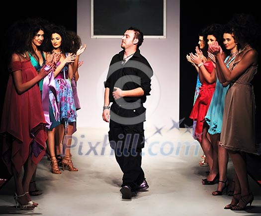 young successful fashion designer on the end of fashion show young successful fashion designer on the end of fashion show