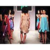 young beautiful model walking on fashion show piste