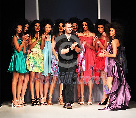 young successful fashion designer on the end of fashion show young successful fashion designer on the end of fashion show