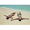 happy young romantic couple in love have fun and relaxing on beautiful beach