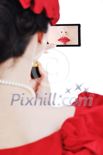 beautiful young pinup woman apply makeup and cosmetics beauty treatment isolated on white in studio beautiful young pinup woman apply makeup and cosmetics beauty treatment isolated on white in studio
