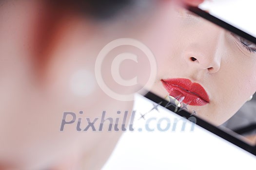 beautiful young pinup woman apply makeup and cosmetics beauty treatment isolated on white in studio beautiful young pinup woman apply makeup and cosmetics beauty treatment isolated on white in studio