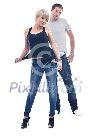 young couple isolated on white in fashionable underwear and blue jeans clothing