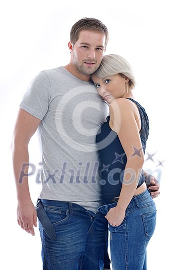 young couple isolated on white in fashionable underwear and blue jeans clothing