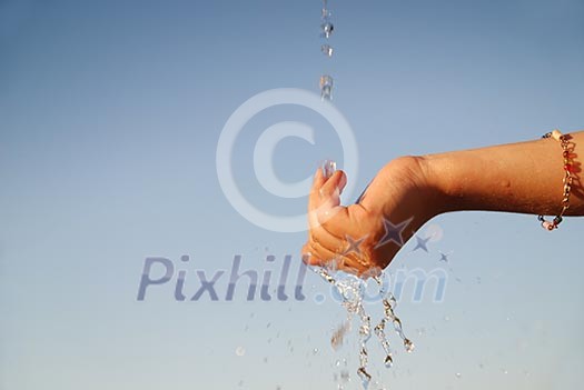 clear water falling on children hands