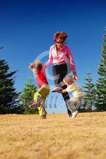 mother and kids having fun outside mother and kids having fun outside