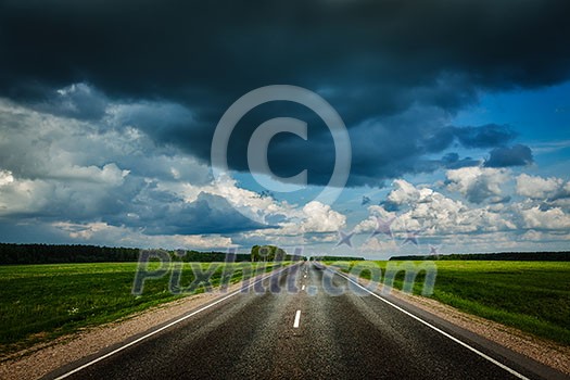 Travel concept background - road and stormy sky Travel concept background - road and stormy sky
