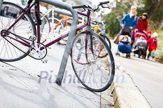 Good place to live - Street urban scenery with lots of bikes and families with children Good place to live - Street urban scenery with lots of bikes and families with children