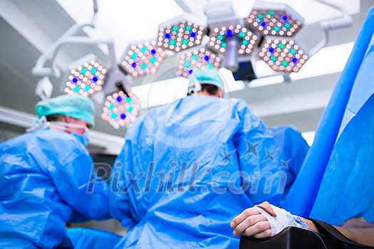 Unidentified boy undergoing a surgery. Focus on the monitor with vital functions Unidentified boy undergoing a surgery. Focus on the monitor with vital functions