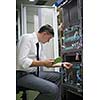 network engineer working in  server room, corporate business man working on tablet computer