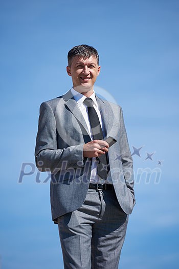urban outdoor portrait of middle aged senior  business man