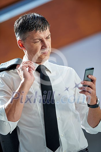 business man using phone at modern office space business man using phone at modern office space