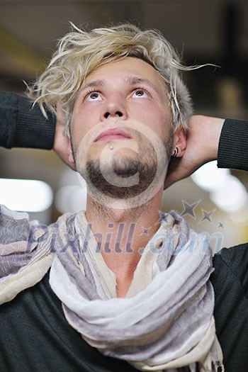 Portrait of an handsome young man with urban background and fashion clothes style Portrait of an handsome young man with urban background and fashion clothes style