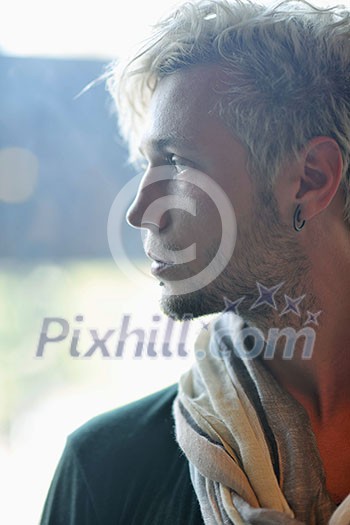 Portrait of an handsome young  man  with urban background and fashion clothes style