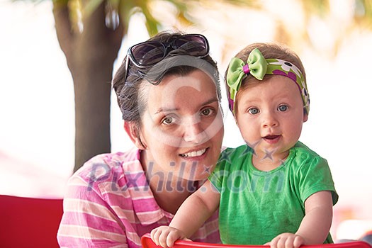 portrait of happy young mother and baby  while have  fun