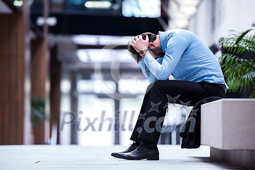 frustrated young business man working on laptop computer at office