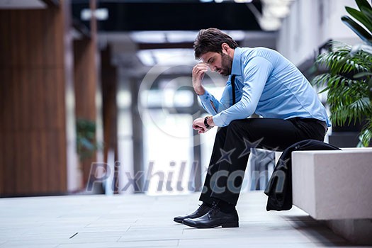 frustrated young business man working on laptop computer at office