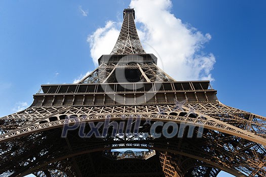 Eiffel Tower in Paris against a dramatic blue sky at day tourist and travel attraction