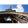 Eiffel Tower in Paris against a dramatic blue sky at day tourist and travel attraction