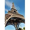 Eiffel Tower in Paris against a dramatic blue sky at day tourist and travel attraction