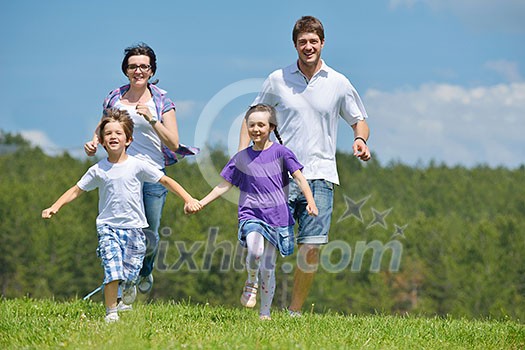 happy young family with their kids have fun and relax outdoors in nature with blue sky in background happy young family with their kids have fun and relax outdoors in nature with blue sky in background