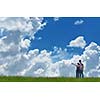 Portrait of romantic young couple in love  smiling together outdoor in nature with blue sky in background