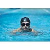 young healthy with muscular body man swim on swimming pool and representing healthy and recreation concept