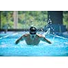 young healthy with muscular body man swim on swimming pool and representing healthy and recreation concept