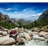 Hiker trekkers read a trekking map on trek in Himalayas mountains. Himachal Pradesh,India