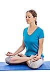 Yoga - young beautiful woman yoga instructor doing Lotus Position (padmasana with chin mudra) asana exercise - cross-legged sitting asana for meditation - isolated on white background