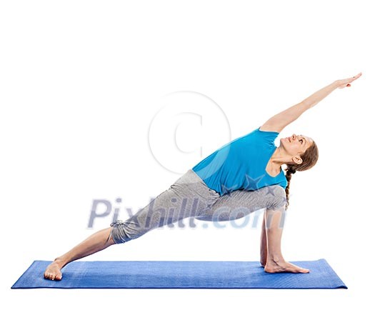Yoga - young beautiful slender woman yoga instructor doing Extended Sides Angle Pose (Utthita Parsvakonasana) asana exercise isolated on white background Yoga - young beautiful slender woman yoga instructor doing Extended Sides Angle Pose (Utthita Parsvakonasana) asana exercise isolated on white background