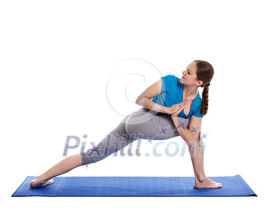 Yoga - young beautiful woman yoga instructor doing Revolved Side Angle Pose (Parivrtta Parsvakonasana) exercise isolated on white background Yoga - young beautiful woman yoga instructor doing Revolved Side Angle Pose (Parivrtta Parsvakonasana) exercise isolated on white background