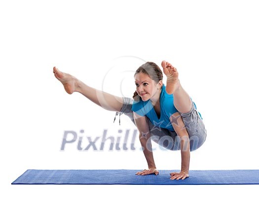 Yoga - young beautiful woman yoga instructor doing Firefly asana pose (Titibasana) exercise isolated on white background Yoga - young beautiful woman yoga instructor doing Firefly asana pose (Titibasana) exercise isolated on white background