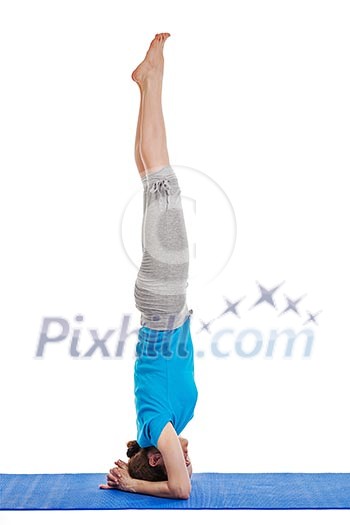 Yoga - young beautiful woman yoga instructor doing headstand (sirsasana) asana exercise isolated on white background Yoga - young beautiful woman yoga instructor doing headstand (sirsasana) asana exercise isolated on white background