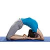 Yoga - young beautiful woman yoga instructor doing Pigeon pose asana(kapotasana) exercise isolated on white background