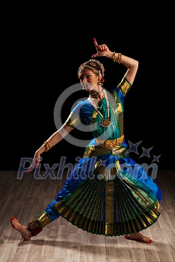 Young beautiful woman dancer exponent of Indian classical dance Bharatanatyam Young beautiful woman dancer exponent of Indian classical dance Bharatanatyam